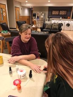 painting nails at assisted living community