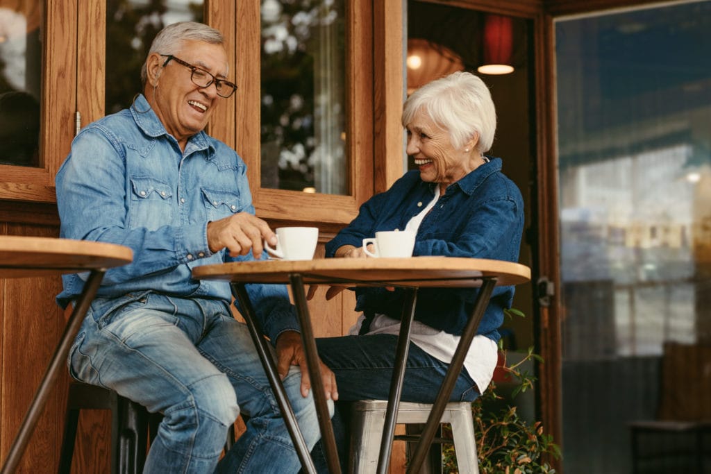 Senior couple adjusting to retirement over coffee