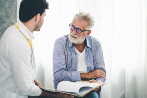 a psychologist discussing behavioral health with a patient
