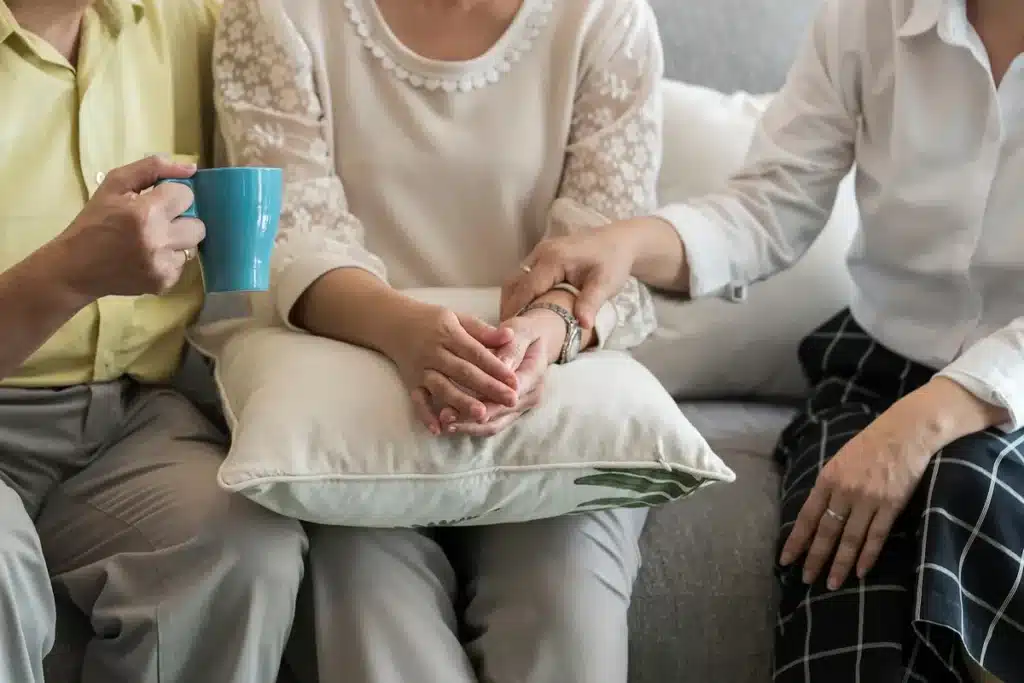 dementia patients sitting on couch at care home