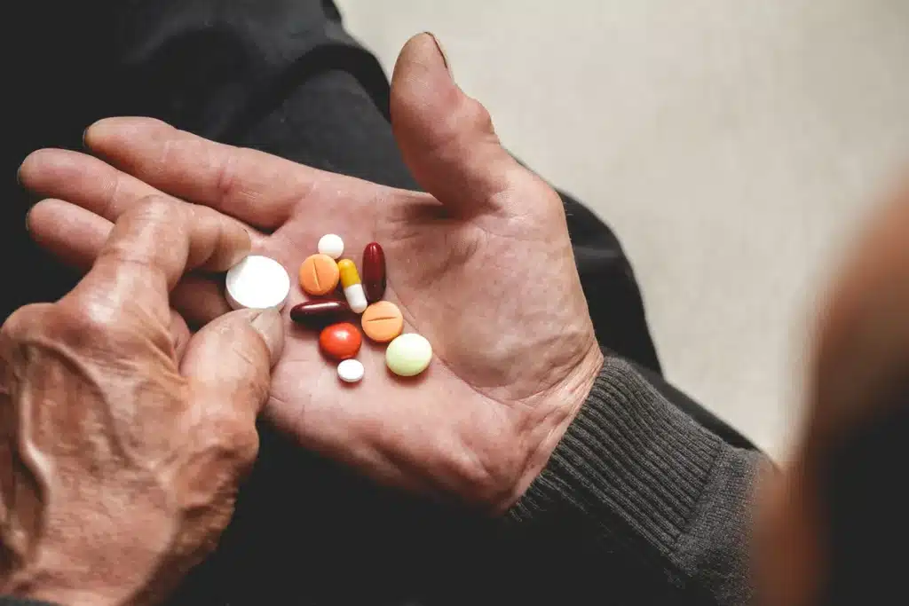 older man manages medication to avoid triggers for sundowning