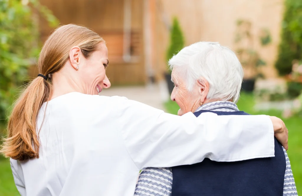 caregiver walking with the elder- how to get power of attorney for a parent with dementia