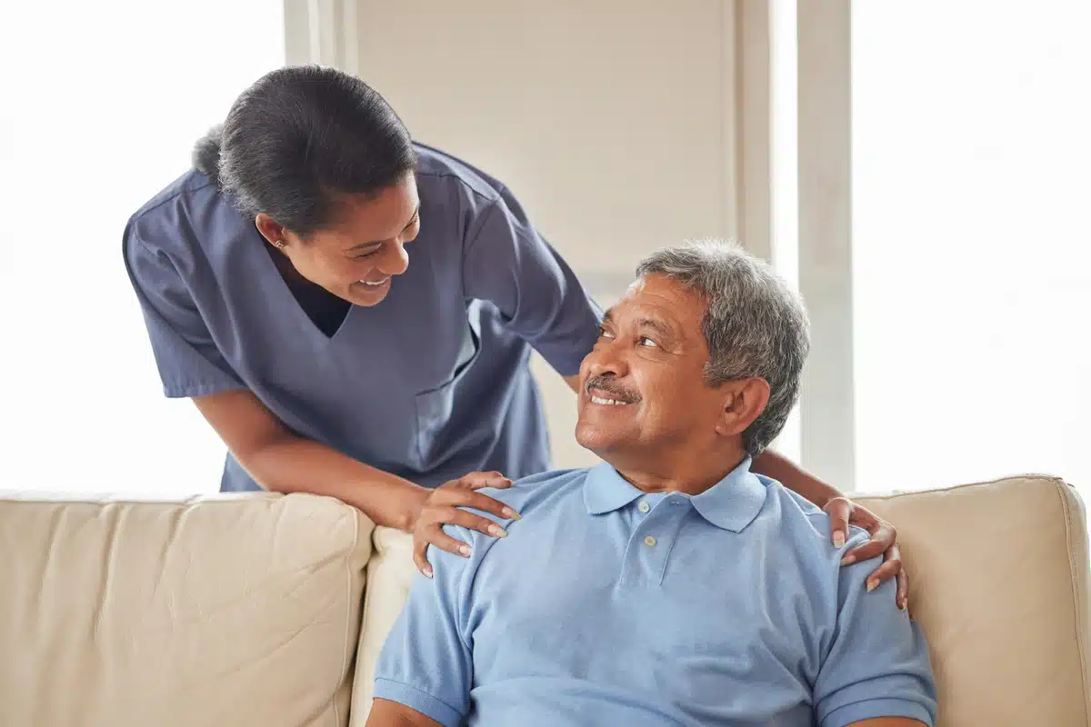 elderly man talking to the care giver at nursing home