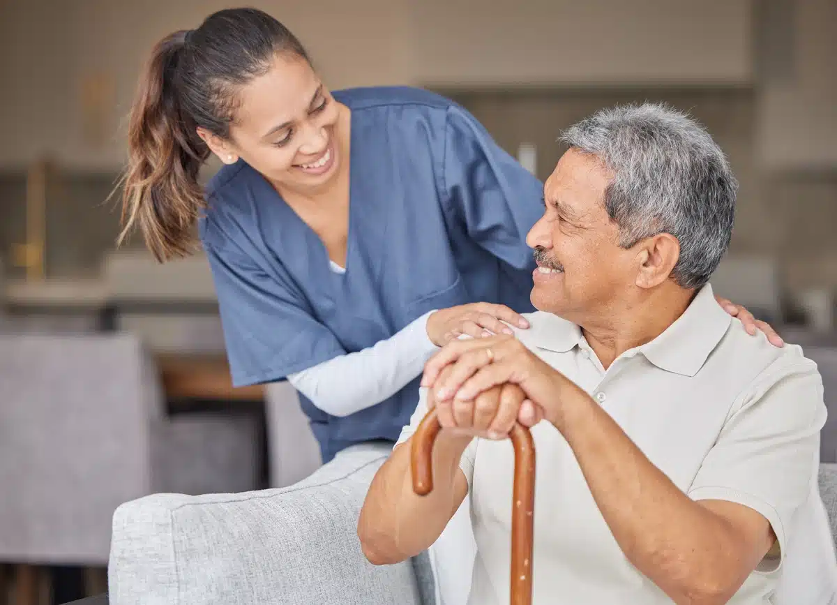 senior man sitting and talking to the caregiver