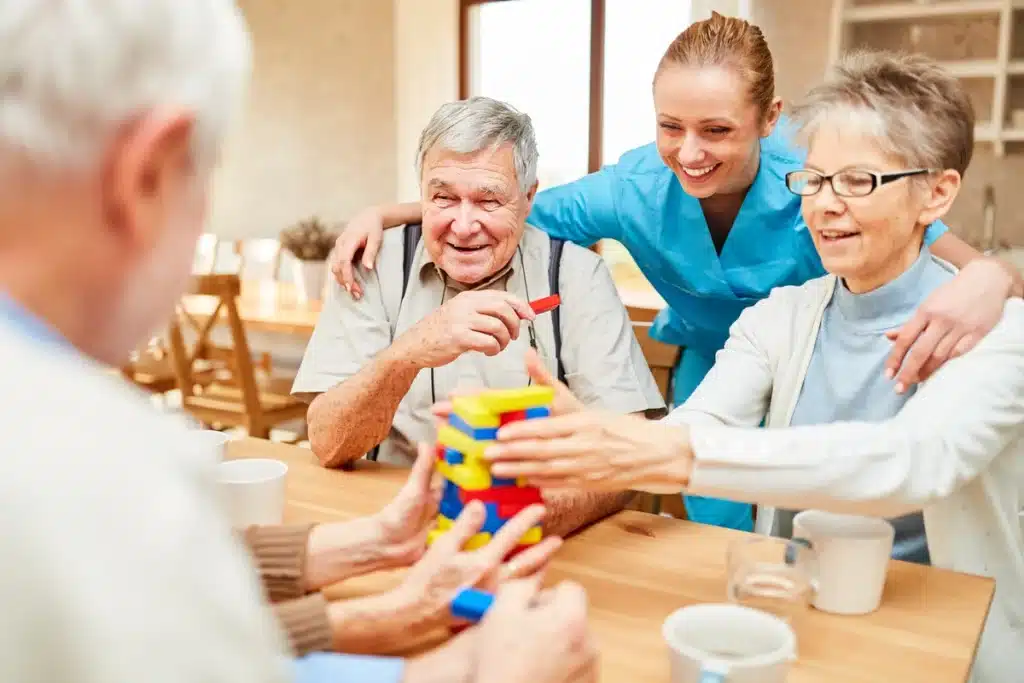 elderly people playing games at memory care facility