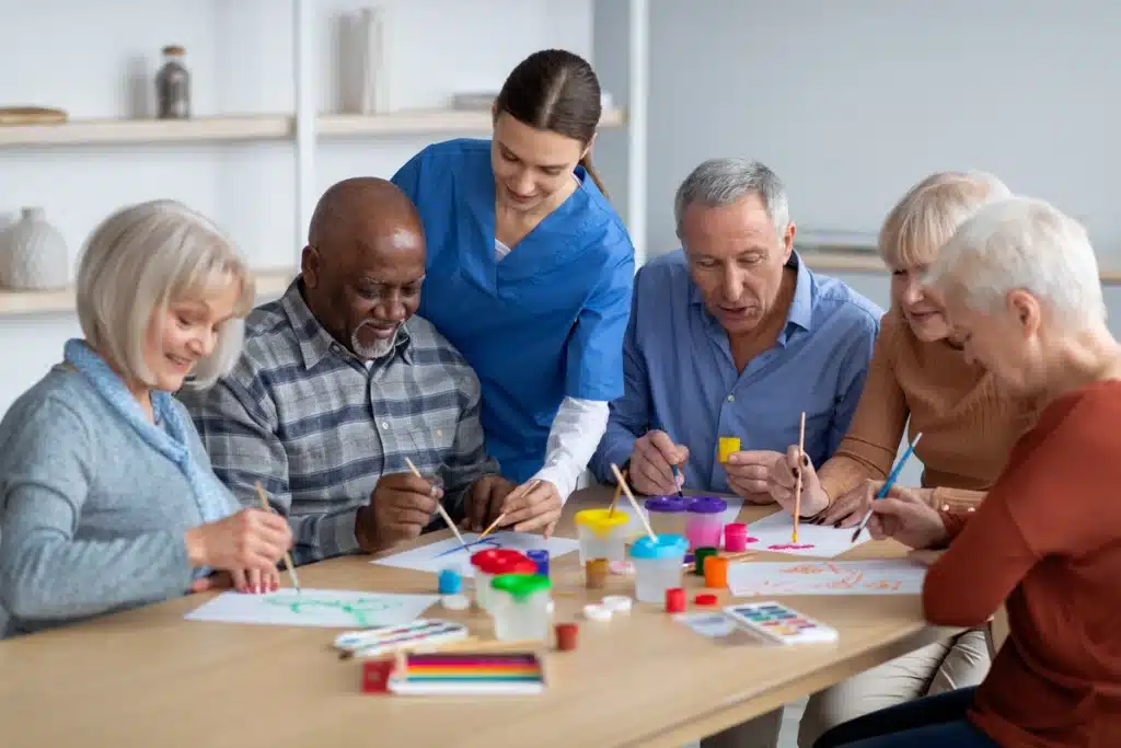 group of seniors doing art activities together 