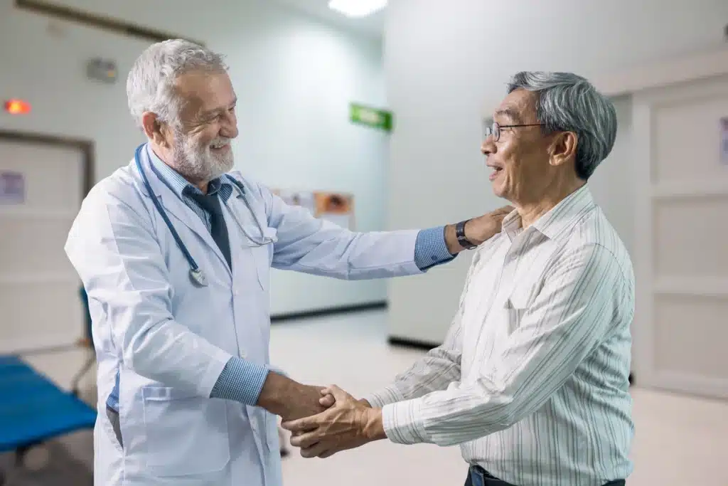 Man and doctor shake hands
