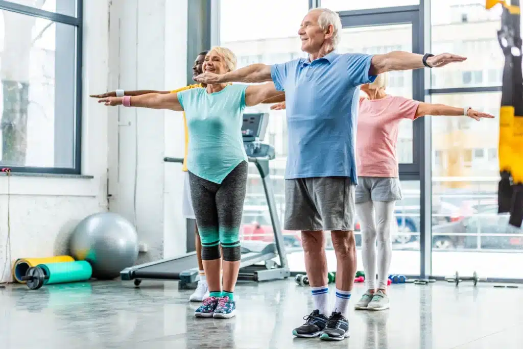 Elderly group performs coordination exercises for mobility