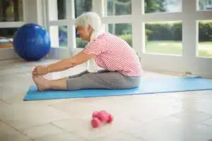 older woman does yoga