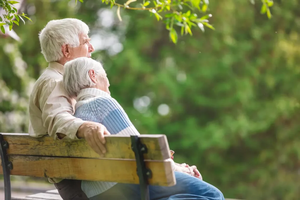 older couple on a bench older couple on a bench