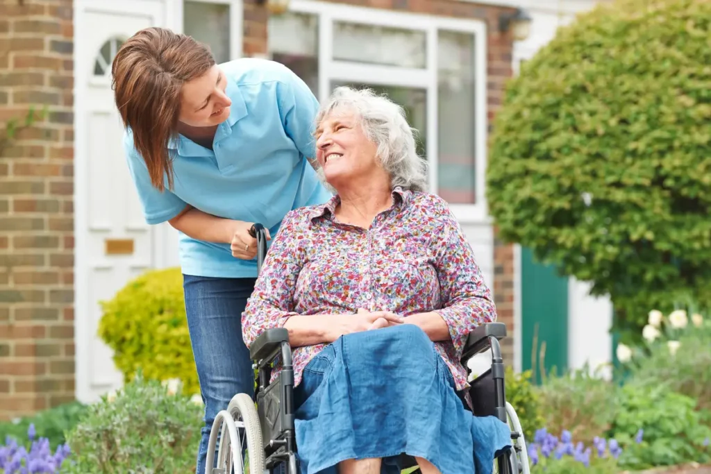 smiling with woman in wheelchair smiling with woman in wheelchair
