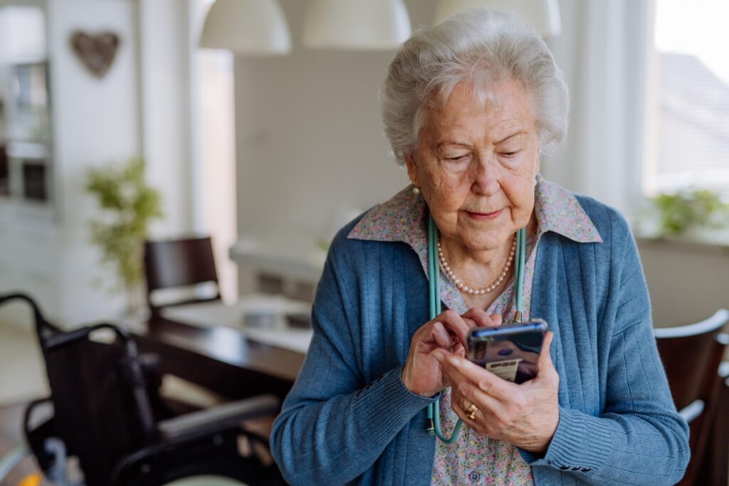 Portrait of senior woman with a smartphone.